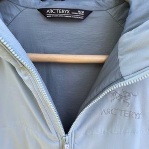 Arc’teryx Atom Hoodie, Women’s size M in light blue”.